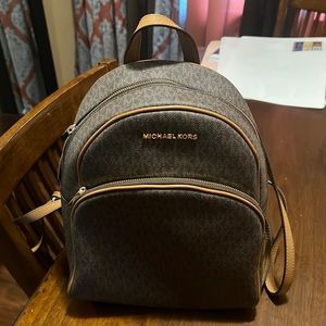 Micheal Kors small logo backpack. Only worn a few times, in good condition.